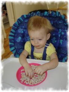 Peanut - 19 months eat off of a plate.
